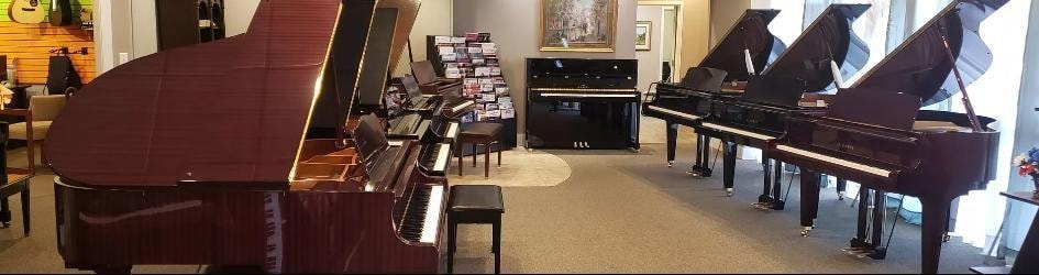 Peabody's Piano Co. showroom interior with grand pianos